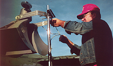 Bob Molloy hangs speakers in the field